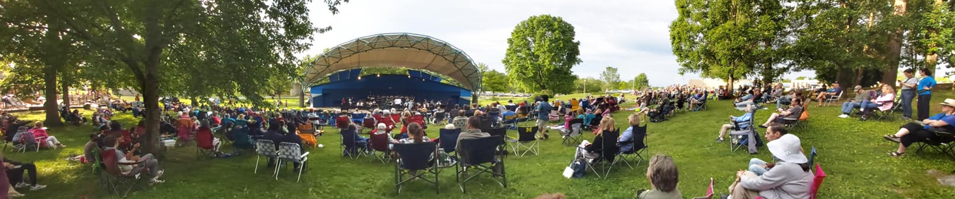 Outdoor concert at Oak Ridge's Bissell Park — crowd on grass watching live performance